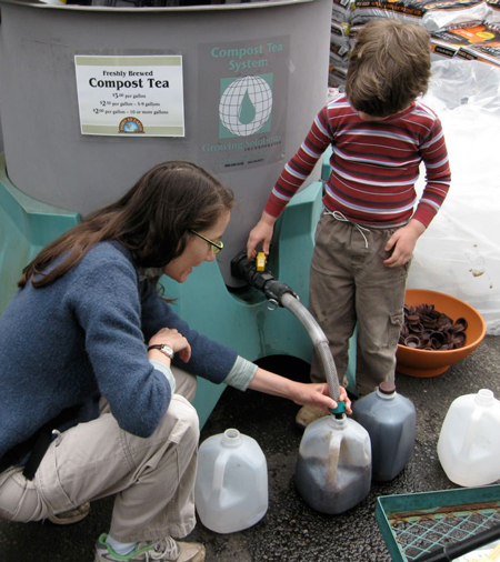 With mom's guidance, a young gardener learns the benefits of compost tea right from the spigot.